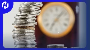jam dan koin yang menjadi ukuran untuk investasi
