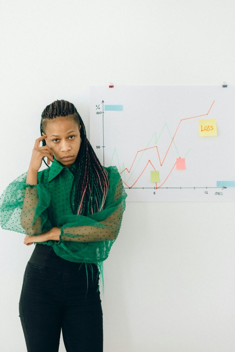 Confident woman analyzing financial chart indoors. Business finance concept.